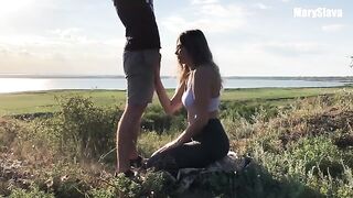 A girl is having fun with her boyfriend outdoors, testing her athletic skills