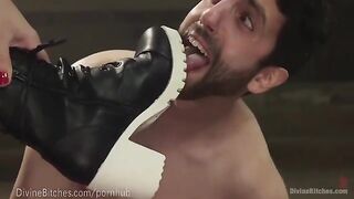 The strong Domina wrestles with her slave in a passionate BDSM session