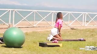 Peruvian woman does sports under the supervision of a gym teacher