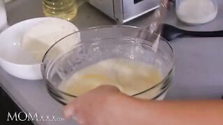 The petite stepdaughter gets spanked and fucked by her sexy stepmom in the kitchen
