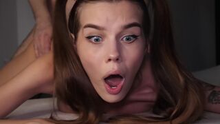The tight ass of a young girl is being torn by a huge cock