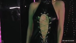 A skinny teen AngelQ takes off clothes on the erotic stage