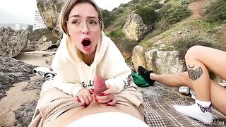 Two young girls enjoy intense pleasure on the beach during their vacation
