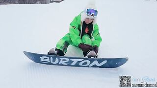 A girl was snowboarding without clothes at the ski resort, experiencing intense pleasure