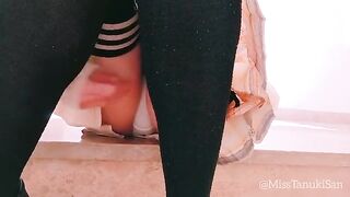A hot schoolgirl with no panties is masturbating herself in a provocative pose