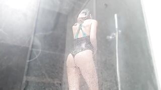 A woman has a wet pussy orgasm in the shower after masturbating