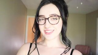 A girl is reading a hilarious book and trying not to cum while doing it