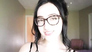 A girl is reading a hilarious book and trying not to cum while doing it