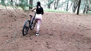 A beautiful woman met a friend while on her bike ride