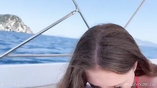 A girl is having fun with her friend on a yacht, while the guy sleeps