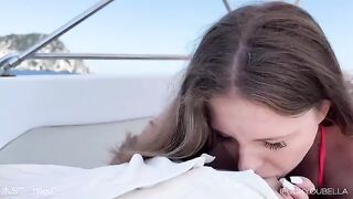 A girl is having fun with her friend on a yacht, while the guy sleeps