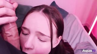 A schoolgirl is having fun with a big dick in her mouth