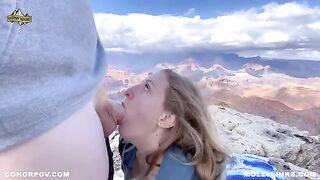 Amateur couple having sex on top of the cliff during a hike