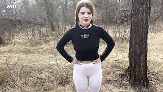 A girl is having fun with a boy in the forest, right in nature