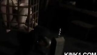 The slave is locked in a cage and forced to fulfill all the master's orders
