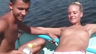 Sexual young people are having fun on the river bank