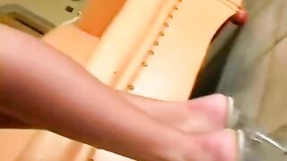 Beautiful woman masturbates on a leather chair and reaches a strong orgasm