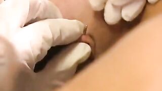 A girl with a nice pussy plays with her new clit piercing
