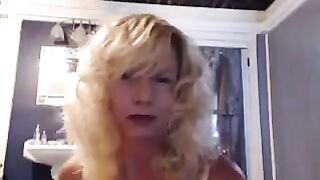 A nice woman aged has pleasure in the bathroom with a toy