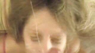 A cum shot on the girl's face after a passionate blowjob session