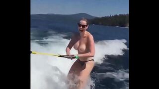 Topless beauty riding on the water skiing is a very erotic view