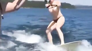 Topless beauty riding on the water skiing is a very erotic view