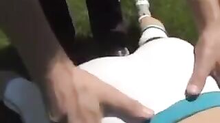 A cum shot on the breasts of a busty brunette woman in sexy sports clothes