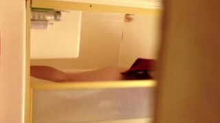 A girl has sex in the shower and gets filmed