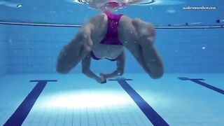 Nude beauty swimming in the pool is a very nice view to see