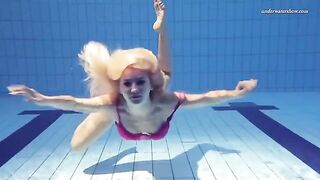 Nude beauty swimming in the pool is a very nice view to see