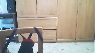A woman fucks in front of her webcam and her husband