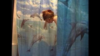 A guy secretly shoots his naked wife in the bathroom