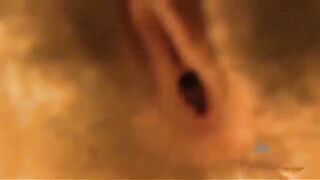 A man gets his dick sucked by a woman in a glory hole