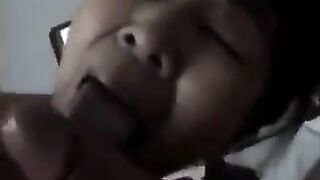 An adult Chinese woman practices her blowjob skills with enthusiasm