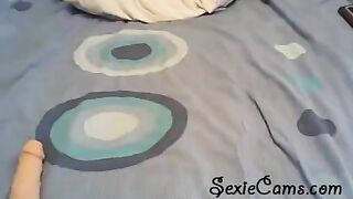 The girl tests her new toy in front of a webcam