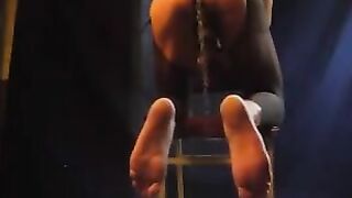 A man in pantyhose stands cancer and holds his cock with a chubby wife