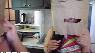 The participants of the swingers party wear bags on their heads