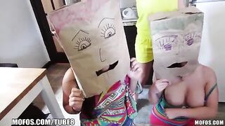 The participants of the swingers party wear bags on their heads