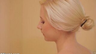 A cute girl masturbates with a toothbrush, showcasing her playful side