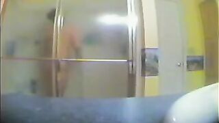 A girl took shower, not knowing that there was a secret camera filming her