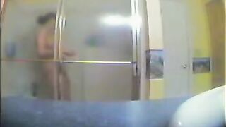 A girl took shower, not knowing that there was a secret camera filming her