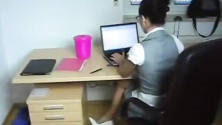 The young secretary has sex with her boss directly in the workplace