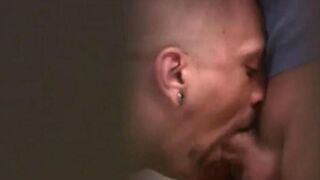 Two guys are jerking each other off in the public toilet