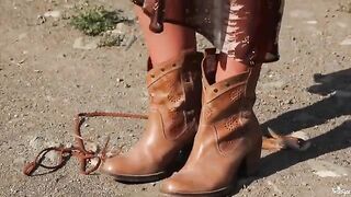 A blonde is masturbating outdoors, her body reacting intensely to the stimulation