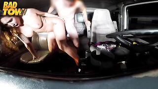 The camera is shooting the registry of the car. A hot girl is sitting next to the driver