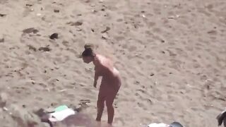 A pair of naturists have fun on the sea