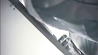 The cam is hidden at the checkout in the store and shoots up skirts