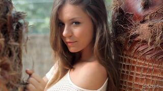 A young Russian girl is dancing erotically and undressing slowly