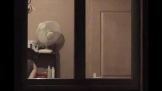 He admires to himself in the mirror, completely naked