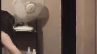 He admires to himself in the mirror, completely naked